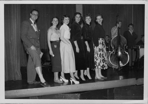 Candidates for Miss Huckster of Woodbury's 1951 Huckster's Ball Line Up on Stage