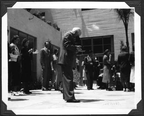 "Pop" Whitten takes Photos of Faculty with a Camera at Woodbury College