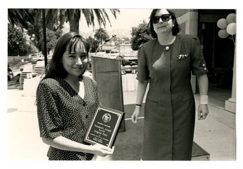 Gregoria Perez Holding an Award at the 1993 Woodbury University Awards Convocation