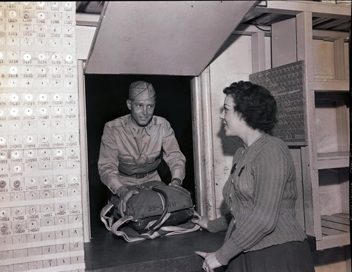 Cadet checking in a parachute, Hancock College of Aeronautics