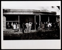 Charles Owens in front of a grocery store, Los Angeles, between 1860-1890