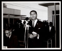 Loren Miller, seated, and Billy Mills at the opening of the English Square office building, Los Angeles, 1964