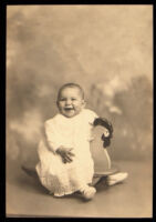 Louise, an infant girl, on a hobby horse, 1926