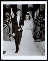 African American couple on their wedding day, likely at the First African Methodist Episcopal Church, Los Angeles, 1940s-1950