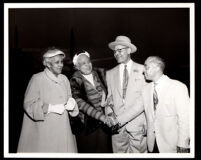 Drs. Vada and John Somerville and Gilbert Lindsay greet Daisy Lampkin at an airport, Los Angeles, 1954 (?)