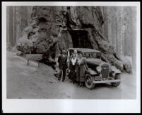 Titus Alexander with his wife, Mary Alexander at the Wahwona Tree, Yosemite National Park, 1920-1930