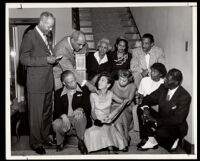 Meeting in a home to plan a hurricane relief effort for Jamaica, Los Angeles, 1951