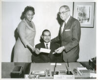 Dr. H. Claude Hudson, president of Broadway Federal Savings and Loan, with Peter W. Dauterive, Los Angeles,1960s