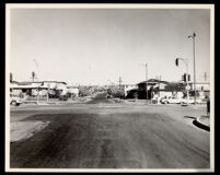 Intersection of a residential street and a major thoroughfare in south central Los Angeles, 1950s-1960s