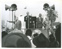 James Roosevelt and Dr. John Somerville on a truck float during a political campaign, Los Angeles, 1950s