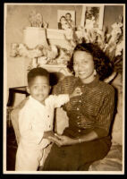 Woman posing with a toddler boy, 1940-1960