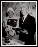 Lorenzo Bowdoin with Theresa Lindsay receiving an award from the Women's Sunday Morning Breakfast Club, Los Angeles, 1962