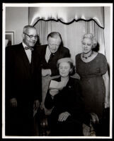 Drs. John and Vada Somerville with a man and woman in a home, 1950s-1960s