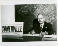 Dr. John A. Somerville seated in an office when he was running for City Council candidate, Los Angeles, 1960s (?)