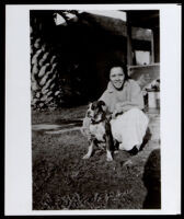 Nelle Johnson, aunt of Ralph Bunche with a dog at home, Los Angeles, circa 1919