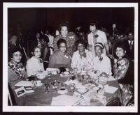 Past western regional directors of Delta Sigma Theta Sorority at a banquet event with Miriam Matthews and 7 others, Los Angeles, 1972