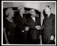 Drs. John and Vada Somerville with a man and woman in a home, 1950s-1960s