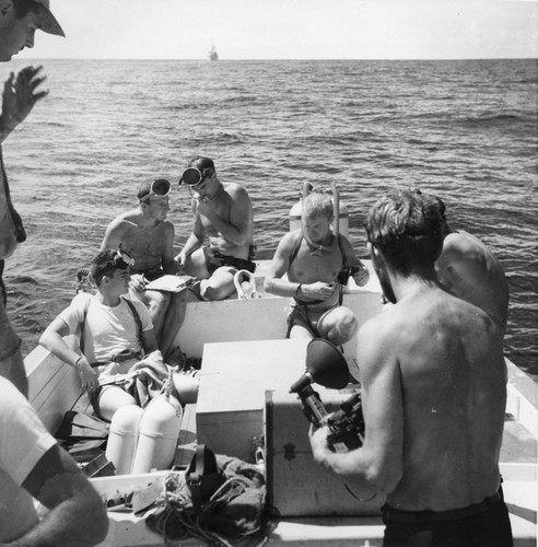 Diving on Alexia Bank. Left to right: William C. "Buddy" King, Robert Floyd Dill (tee shirt), Walter H. Munk, Robert Livingston, Philip E. Jackson, John B. MacFall, two unidentified. Capricorn Expedition, December 9, 1952