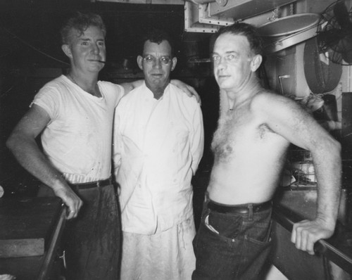 A pause in the lives of the galley crew. Left to right: Thomas J. O'Callaghan, Frank Vaughn, head chef, and Elmer Foster. Midpac Expedition onboard the Horizon. 1950