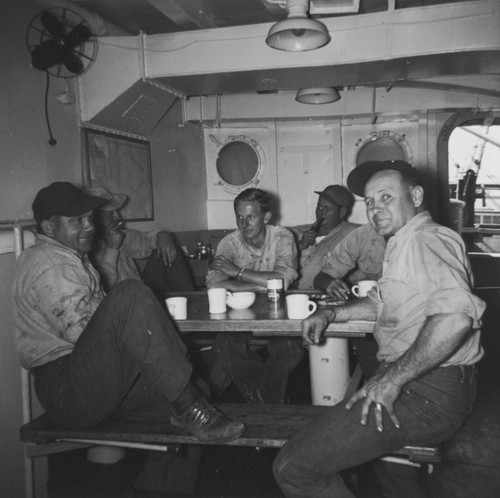 Frank Nolan, Tom Chapman, Clyde Lewis, "Mike" have coffee break in mess hall, R/V Horizon, MidPac Expedition