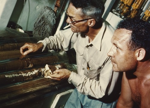 Milton Bramlette and Roger Revelle examine sections of a recently recovered Kullenberg core