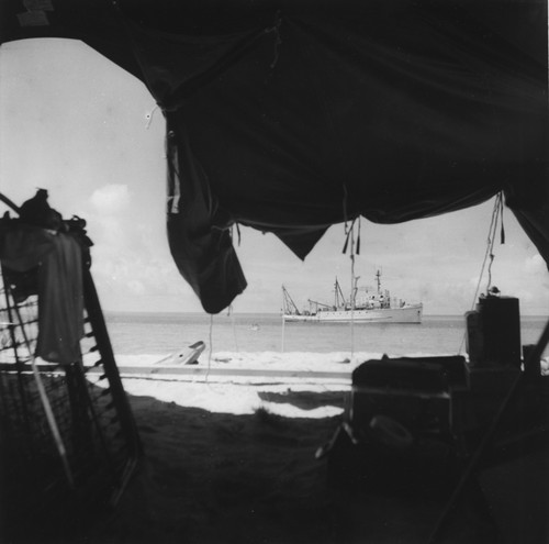 Inside Cherrete Island tent; "Abstain II" encampment finally takes shape. Shore party arriving in small boat as R/V Horizon is anchored off shore