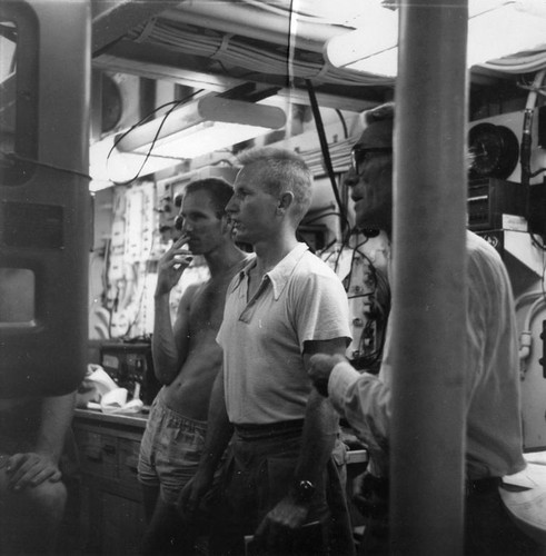 Arthur Maxwell, H. William Menard, M.N. Bramlette observe the fathometer recording at Alexa Bank on R/V Spencer F. Baird