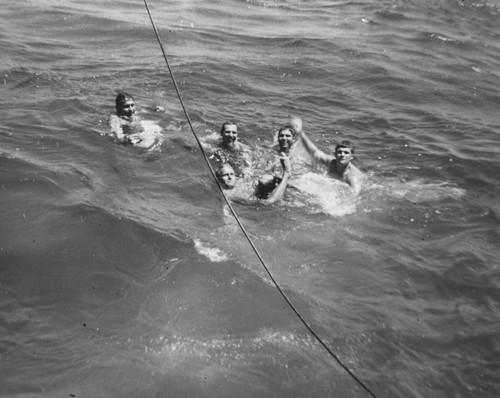 Mid Ocean swim break. Left to right: Roger Revelle, Louis Garrison, Deane Carlson, [William C.] "Buddy" King, Bob Dill