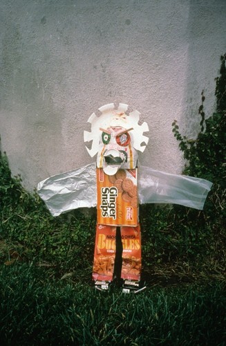 Sun God kachina made from trash