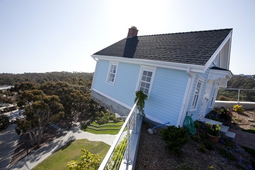 Fallen Star: wide-angle view of house cantilevered out, seven stories off the ground, with eucalyptus groves in the distance