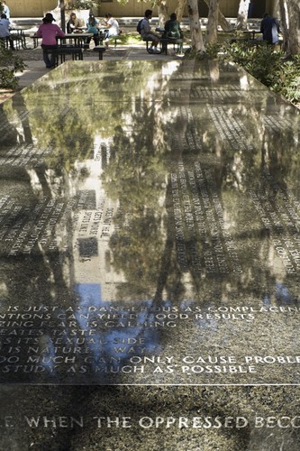 Green Table: detail view of text and reflective surface of the table top