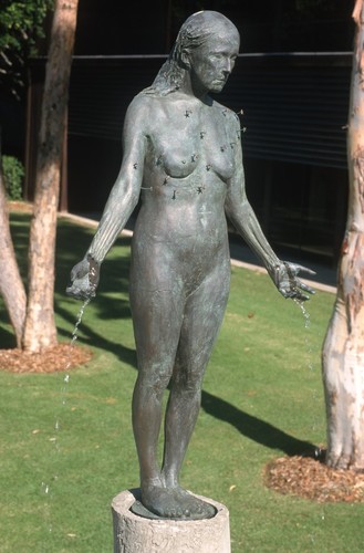 Standing: detail view of bronze figure dripping water, with tiny representations of starfish configured on the torso as the constellation Virgo