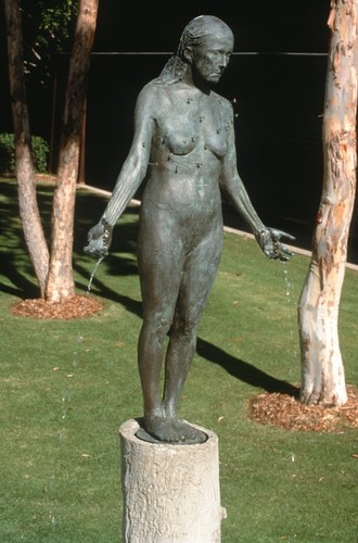 Standing: detail view of bronze figure dripping water, with tiny representations of starfish configured on the torso as the constellation Virgo