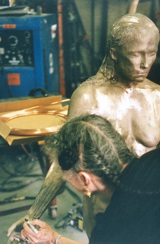 Standing: artist working at the Art Foundry, Santa Fe, New Mexico