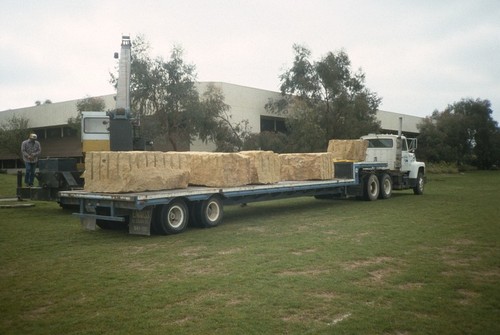 UNDA: view of installation process: delivery truck with stone blocks and crane