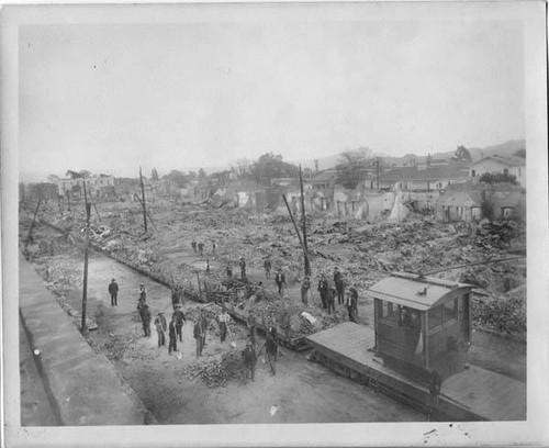 Flatbed train clearing earthquake debris