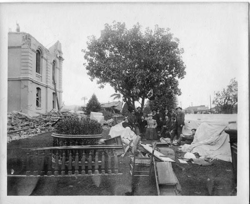 Sonoma County officials pose outside the damaged Sonoma County Courthouse