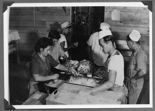 Internees preparing food