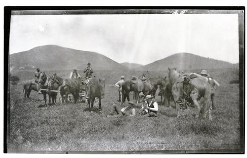 Men and horses in the field, Rancho Santa Anita