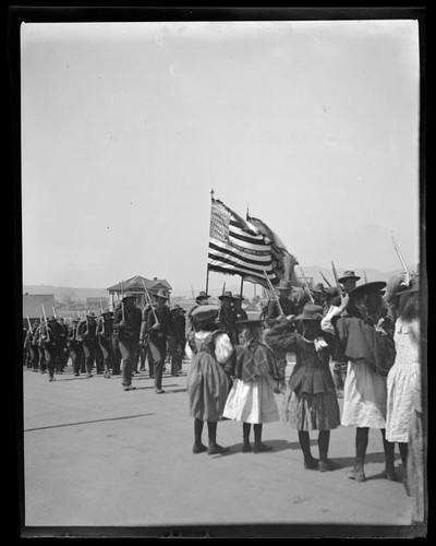 Children watching return of 1st California volunteers from Manila