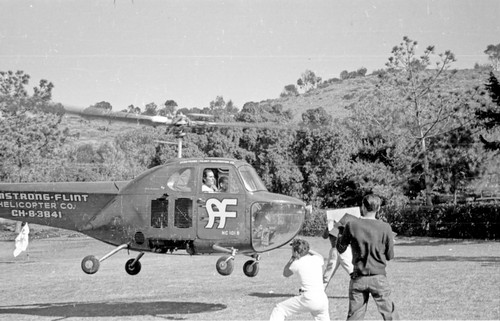 Actor Errol Flynn shown here arriving by helicopter at Scripps Institution of Oceanography. 1948