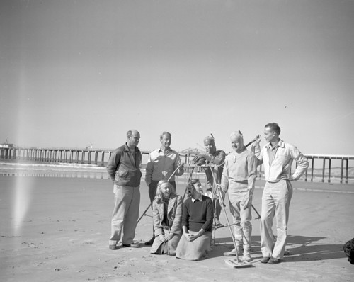 Francis Shepard and geology class design a suspended sediment trap for the study of sand transport onto the beach. Nets were made from the toes of wives' nylon stockings. L-r: Donald Sayner, Francis Shepard, Ray Wilson, Robert Wisner, and Douglas Inman. In front: Ruth Young Manar and Jean Carret. 1948