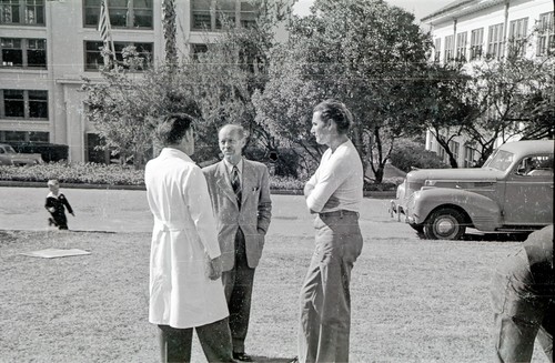 (Left to right) Actor Errol Flynn, Carl Leavitt Hubbs, unidentified man, Laura Clark Hubbs, and Harald Ulrik Sverdrup, talk at Scripps Institution of Oceanography during film production of "Cruise of the Zaca." 1948