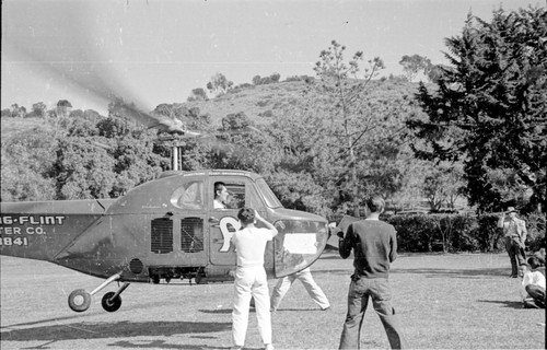 Actor Errol Flynn shown here arriving by helicopter at Scripps Institution of Oceanography