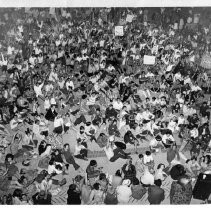 Presidential candidate Eugene McCarthy (not in photo): huge rally, with people sitting on the ground, many waving