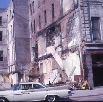 Views of redevelopment sites showing the demolition of buildings in the district. These views date from 1959 to 1964. Specific sites are not identified in this set of images