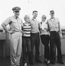 Commander Burnett with 4 others on the USS Sacramento