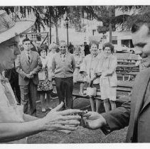 Former Marine Michael Hodgson of Modesto and later, Fair Oaks, with Fair Oaks Chamber of Commerce president Robert J. Beach, left, who is presenting him with a key to the city. Hodgson drew the cartoon "Sgt. Mike" about his years in Vietnam