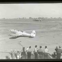 A single engine airplane parked on a runway