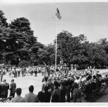 Exterior view of the California State Capitol building showing a crowd during Flag Day ceremonies at the west entrance